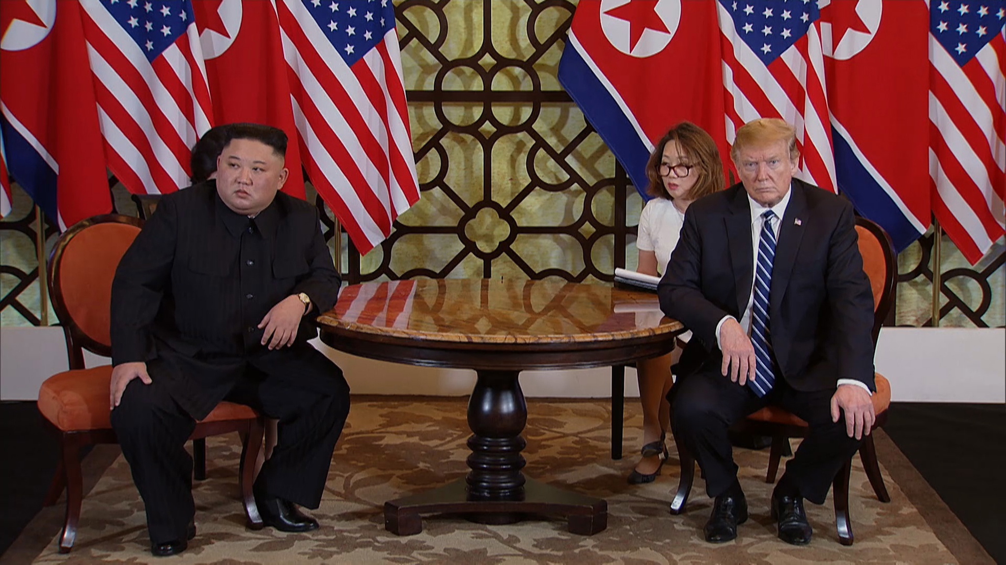 epa07402871 A video grab shows US President Donald J. Trump (R) and North Korean leader Kim Jong-un (L) during the start of their second one on one meeting at the US-North Korea summit in the Sofitel Legend Metropole hotel in Hanoi, Vietnam, 28 February 2019. The second meeting of the US President and the North Korean leader, running from 27 to 28 February 2019, focuses on furthering steps towards achieving peace and complete denuclearization of the Korean peninsula.  EPA/HOST BROADCAST / POOL
