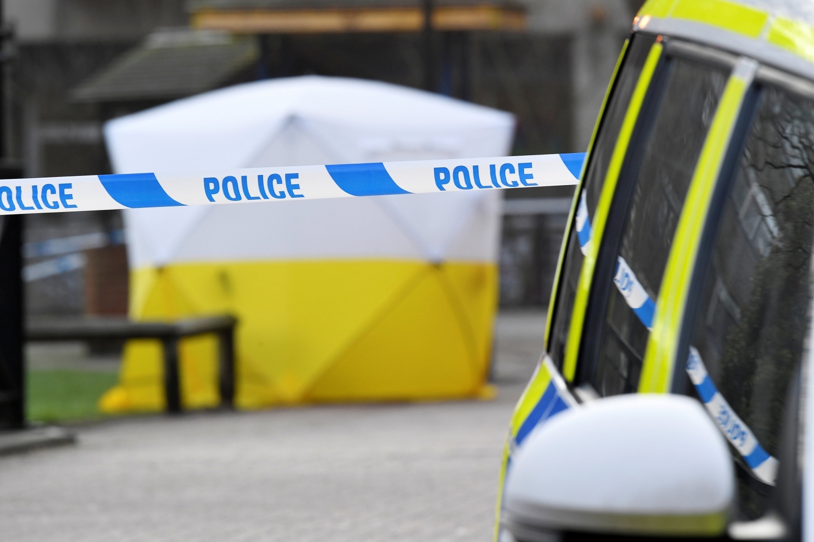 FILE PHOTO: A police car is parked next to crime scene tape, as a tent covers a park bench on which former Russian inteligence officer Sergei Skripal, and a woman were found unconscious after they had been exposed to an unknown substance, in Salisbury FILE PHOTO: A police car is parked next to crime scene tape, as a tent covers a park bench on which former Russian inteligence officer Sergei Skripal was found unconscious in Salisbury, Britain, March 6, 2018. REUTERS/Toby Melville/File Photo Toby Melville