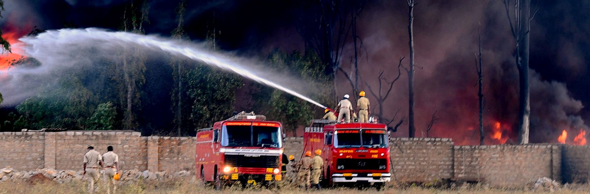 epa07366721 Indian firefighters try to extinguish flames after a fire broke out at the United Paint factory stockyard in madanayakanahalli, on the outskirts of Bangalore, India, 13 February 2019. According to police and media reports, about 15 fire engines fought for close to four hours to extinguish the blaze. No casualties have been reported in the incident so far.  EPA/JAGADEESH NV