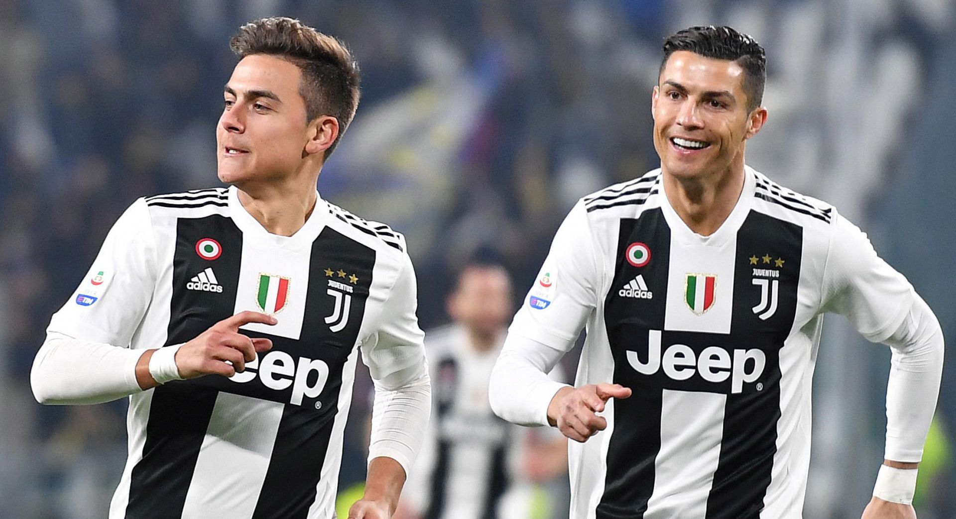 epa07373454 Juventus's forward Paulo Dybala (L) jubilates with his teammate Cristiano Ronaldo after scoring the 1-0 lead during the Italian Serie A soccer match Juventus FC vs Frosinone at the Allianz stadium in Turin, Italy, 15 February 2019.  EPA/ALESSANDRO DI MARCO