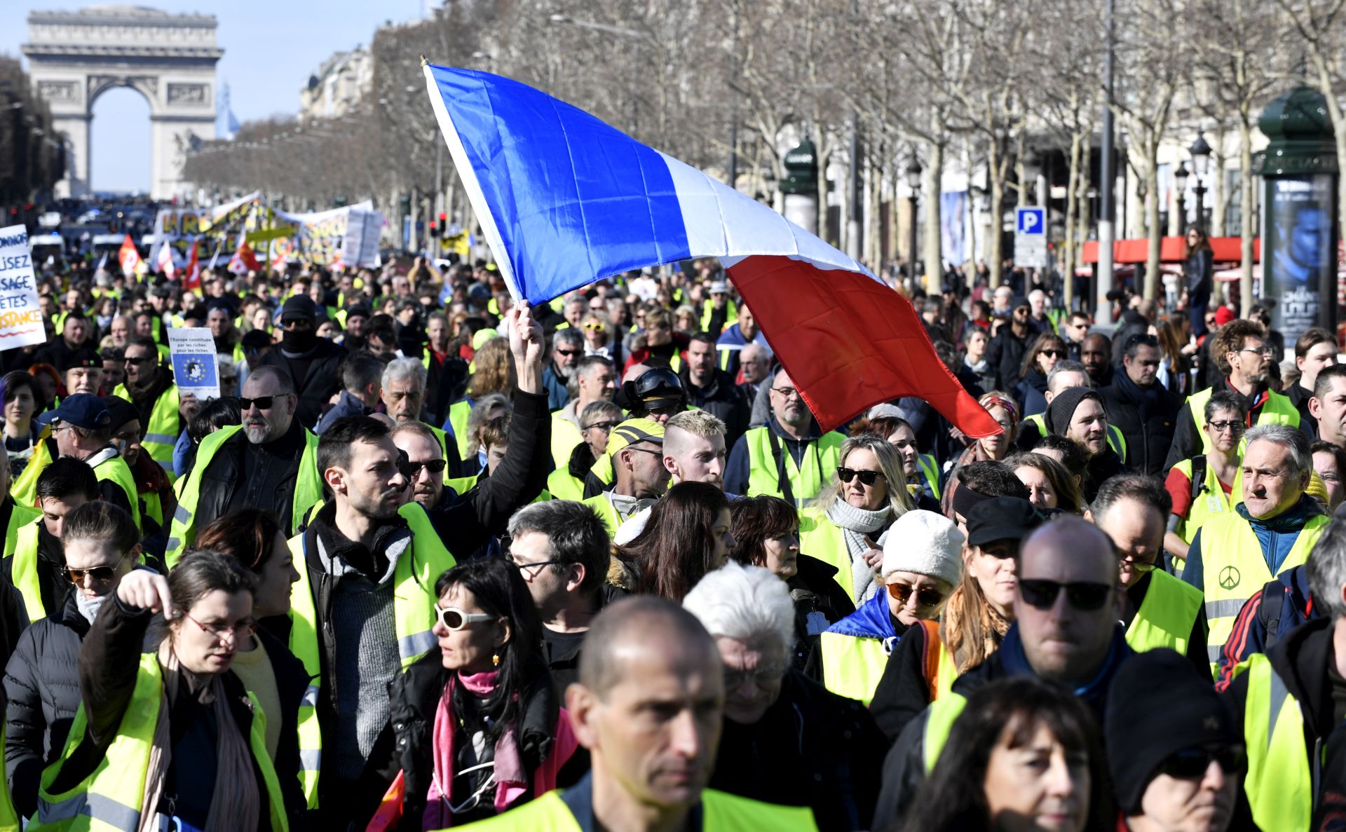 epa07377024 Protesters from the 'Gilets Jaunes' (Yellow Vests) movement participate in a demonstration to celebrate the movement's three-month birthday on the Champs Elysees avenue near the Arc de Triomphe in Paris, France, 17 February 2019. The so-called 'Gilets Jaunes' is a grassroots protest movement with supporters from a wide span of the political spectrum, that originally started with protest across the nation in late 2018 against high fuel prices.  EPA/JULIEN DE ROSA