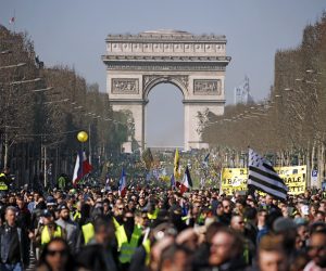epa07389914 Protesters from the 'Gilets Jaunes' (Yellow Vests) movement gather at the Champs Elysees as they take part in the 'Act XV' demonstration (the 15th consecutive national protest on a Saturday) in Paris, France, 23 February 2019. The so-called 'gilets jaunes' (yellow vests) is a grassroots protest movement with supporters from a wide span of the political spectrum, that originally started with protest across the nation in late 2018 against high fuel prices. The movement in the meantime also protests the French government's tax reforms, the increasing costs of living and some even call for the resignation of French President Emmanuel Macron.  EPA/YOAN VALAT