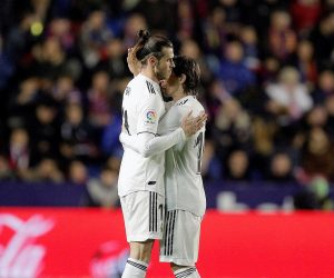 epa07394069 Real Madrid's Welsh Gareth Bale (L) celebrates with Croatian Luka Modric (R) after scoring the 2-1 lead against UD Levante during their LaLiga soccer match played at the Ciutat de Valencia stadiium, in Valencia, Spain, 24 Febraury 2019.  EPA/Kai Foersterling