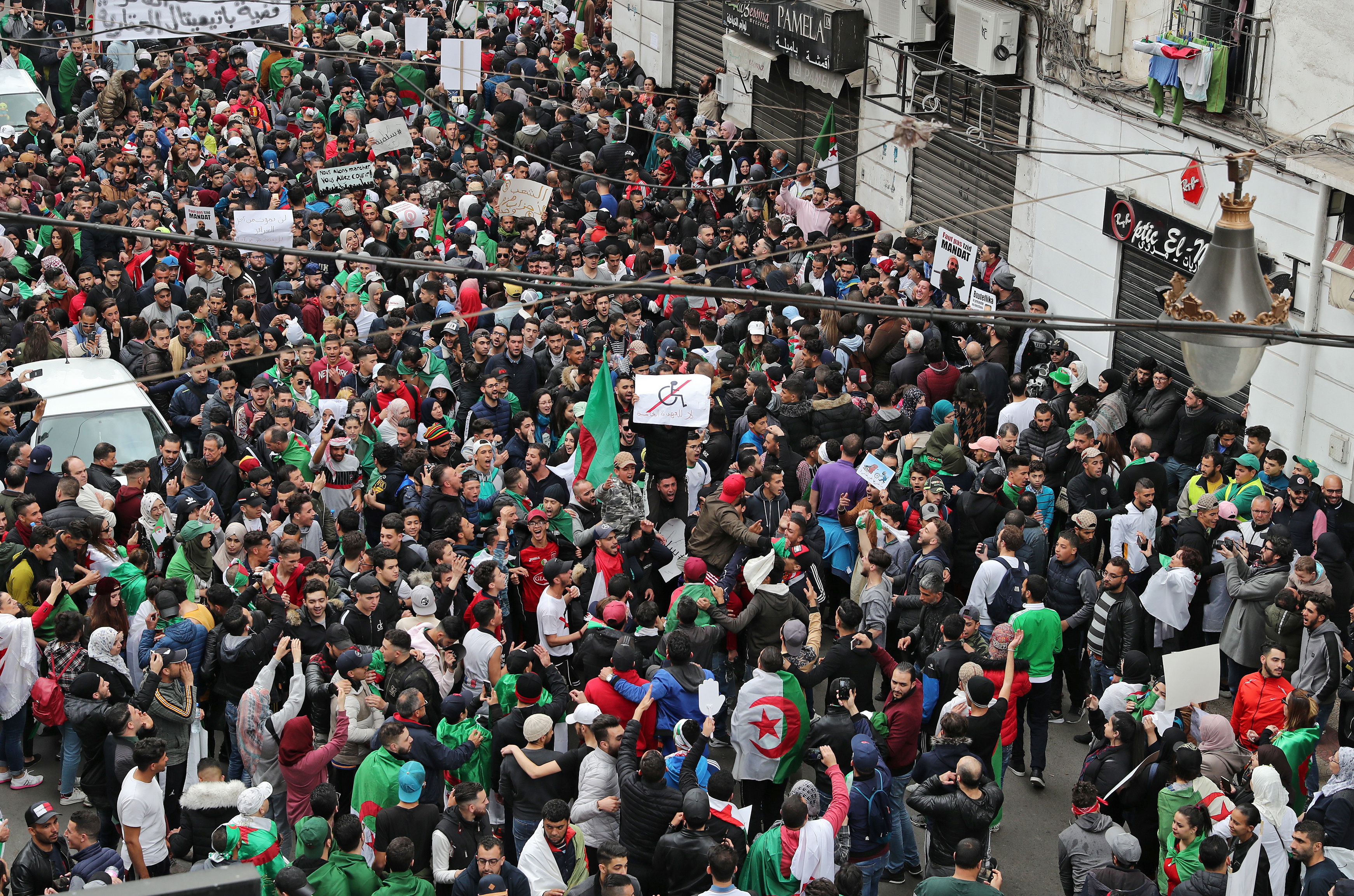 epa07422708 Algerian protesters during a protest against the fifth term of Abdelaziz Bouteflika in Algiers, Algeria, 08 March 2019. Algerian authorities on 01 March braced for what are expected to be the largest protests in the Algerian capital in over a decade. Several protests and rallies were held in Algeria since Bouteflika serving as the president since 1999, announced he will be running for a fifth term in presidential elections scheduled for 18 April 2019.  EPA/MOHAMED MESSARA
