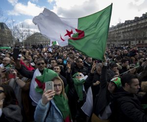 epa07427029 Members of the Algerian community in Paris protest against the fifth term of Algerian President Abdelaziz Bouteflika on Place de la Republique in Paris, France, 10 March 2019. Protests and rallies have taken place in Paris, organized by the Algerian community in France since Bouteflika serving as Algerias president since 1999, announced he will be running for a fifth term in presidential elections scheduled for 18 April 2019.  EPA/IAN LANGSDON