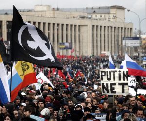 epa07426789 People attend an opposition rally in Moscow, Russia 10 March 2019. Participants in the rally are protesting against the bill about sovereign RuNet and censorship on the Internet.  EPA/MAXIM SHIPENKOV