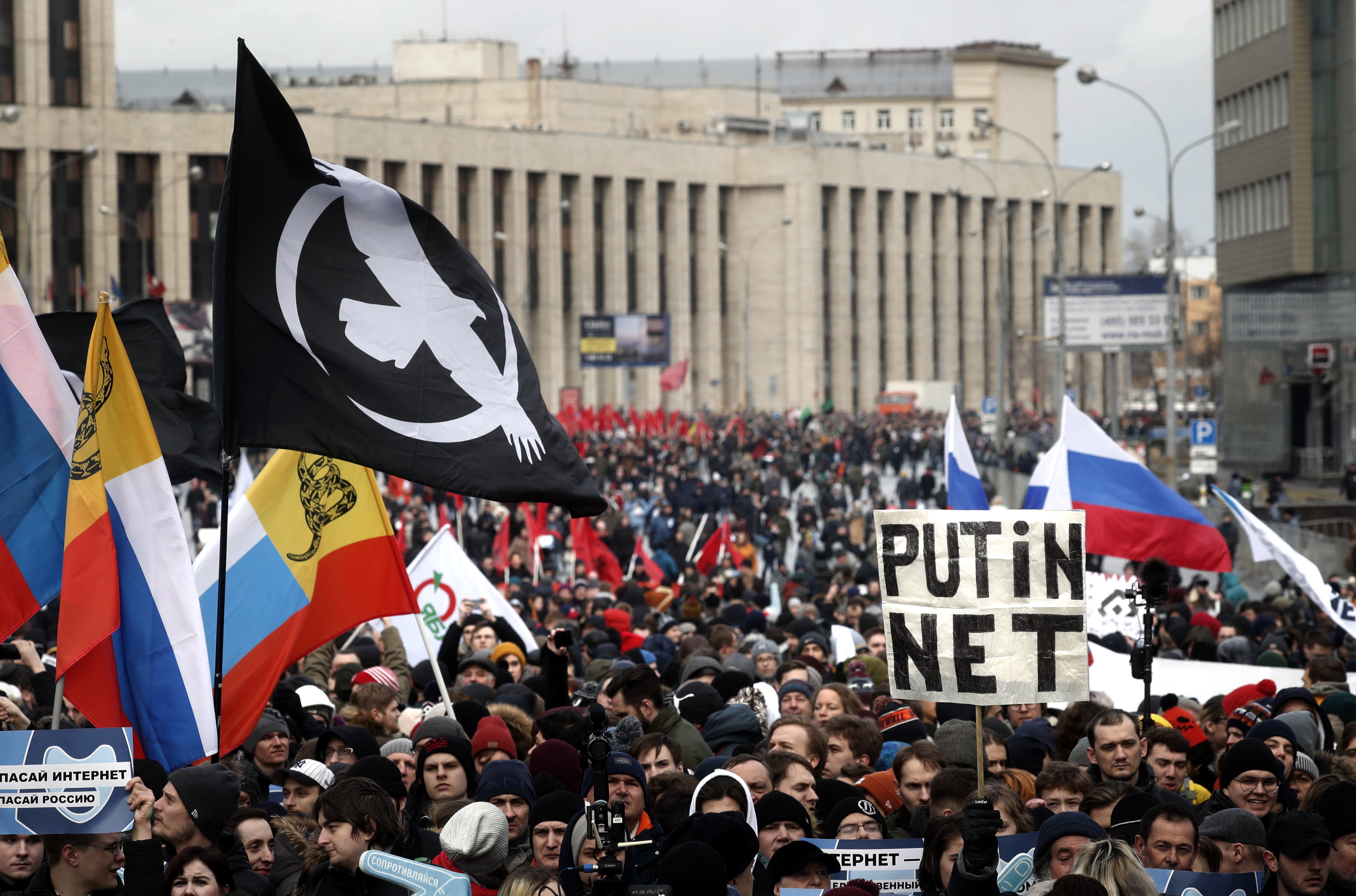 epa07426789 People attend an opposition rally in Moscow, Russia 10 March 2019. Participants in the rally are protesting against the bill about sovereign RuNet and censorship on the Internet.  EPA/MAXIM SHIPENKOV