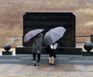epa07428301 People offer prayers for victims of the 11 March 2011 Great East Japan Earthquake at a cenotaph in Namie, Fukushima Prefecture, northeastern Japan, 11 March 2019, the day of the eighth anniversary of the 9.0-magnitude earthquake and subsequent tsunami, that devastated northeastern Japan and triggered a nuclear disaster at Fukushima Daiichi Nuclear Power Plant. Latest official reports state that the earthquake and tsunami killed 15,897 people while 2,553 are still missing.  EPA/JIJI PRESS JAPAN OUT EDITORIAL USE ONLY/  NO ARCHIVES  NO ARCHIVES