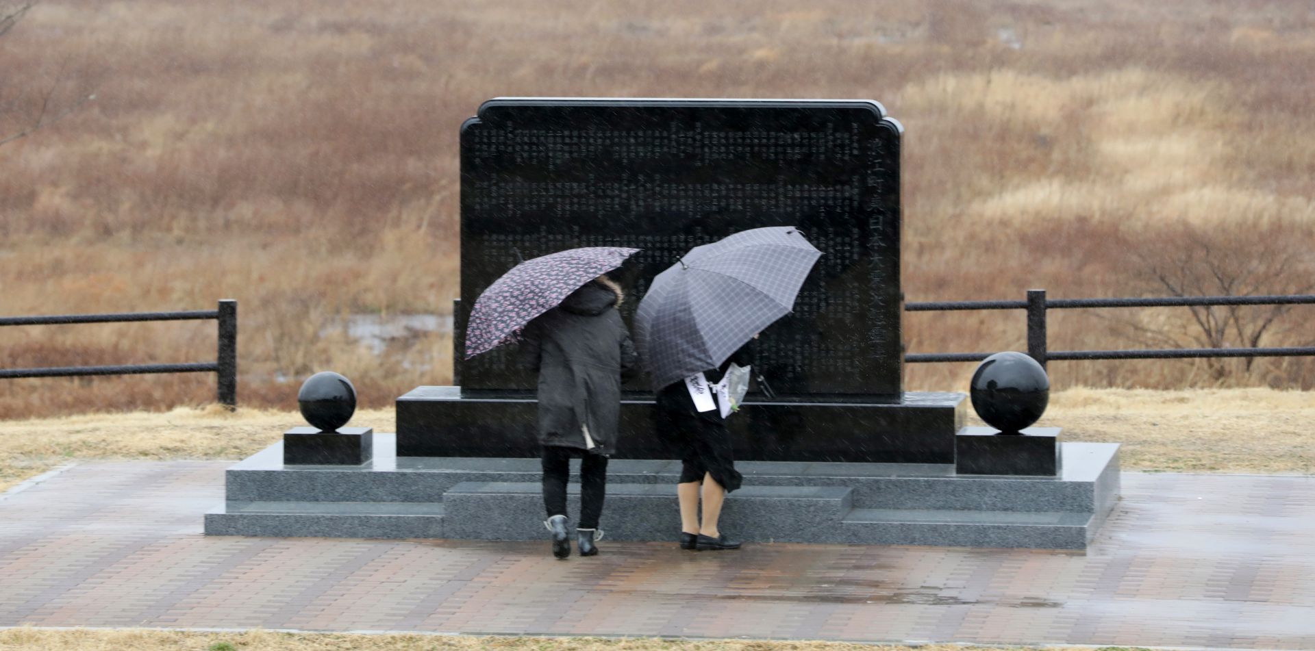 epa07428301 People offer prayers for victims of the 11 March 2011 Great East Japan Earthquake at a cenotaph in Namie, Fukushima Prefecture, northeastern Japan, 11 March 2019, the day of the eighth anniversary of the 9.0-magnitude earthquake and subsequent tsunami, that devastated northeastern Japan and triggered a nuclear disaster at Fukushima Daiichi Nuclear Power Plant. Latest official reports state that the earthquake and tsunami killed 15,897 people while 2,553 are still missing.  EPA/JIJI PRESS JAPAN OUT EDITORIAL USE ONLY/  NO ARCHIVES  NO ARCHIVES