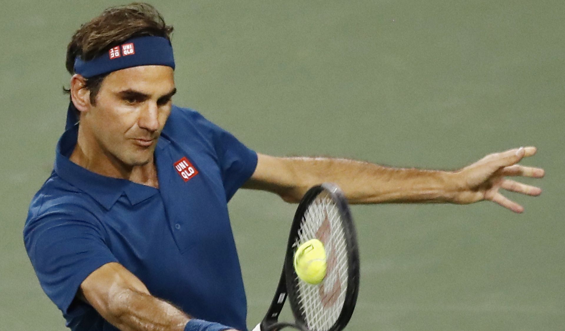 epa07432777 Roger Federer of Switzerland in action against Stan Wawrinka of Switzerland during the BNP Paribas Open tennis tournament at the Indian Wells Tennis Garden in Indian Wells, California, USA, 12 March 2019. The men's and women's final will be played, 17 March 2019.  EPA/LARRY W. SMITH