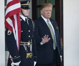 epa07436633 US President Donald J. Trump (L) waits for Irish Taoiseach Leo Varadkar as he arrives at the West Wing of the White House in Washington, DC, USA, 14 March 2019. The President and Taoiseach will meet in the Oval Office, visit the US Capitol and finally participate in the Shamrock Bowl Presentation at a White House reception.  EPA/SHAWN THEW