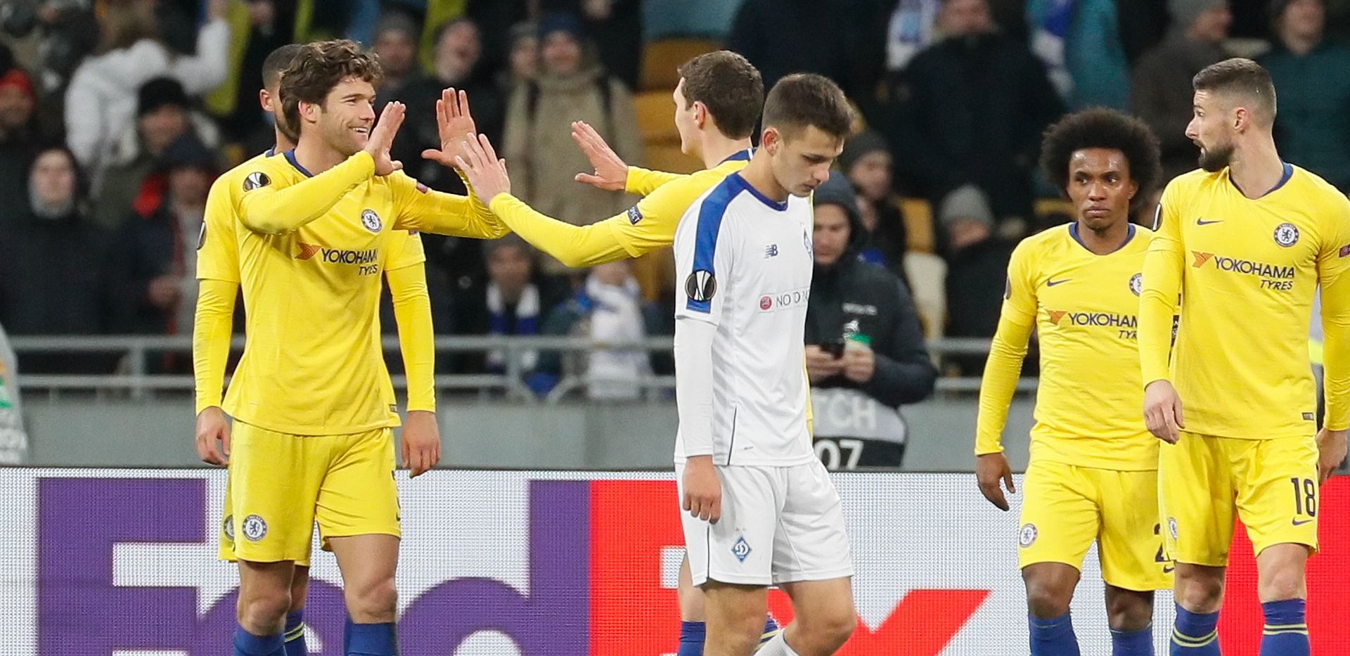 epa07437308 Marcos Alonso (L) of Chelsea celebrates his goal together with teammates during the UEFA Europa League Round of 16, second leg soccer match between FC Dynamo Kyiv and Chelsea FC in Kiev, Ukraine, 14 March 2019.  EPA/SERGEY DOLZHENKO