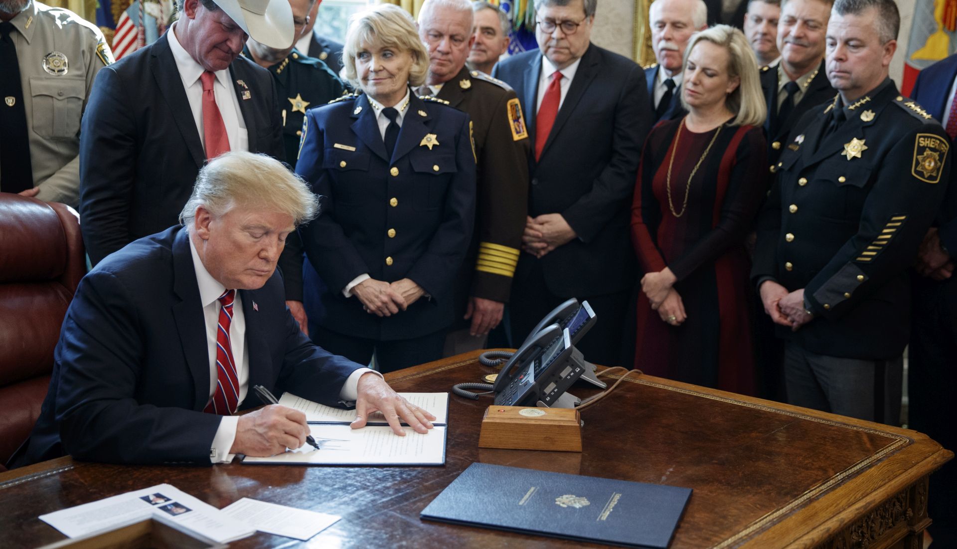 epa07440790 US President Donald J. Trump delivers remarks on the national security and humanitarian crisis on the southern border and vetoes the legislation that strikes down his national emergency declaration at the southern border a ceremony in the Oval Office of the White House in Washington, DC, USA, 15 March 2019. President Trump's veto, his first, sends the resolution back to Congress where it will require a 2/3 vote in each house to overturn.  EPA/SHAWN THEW