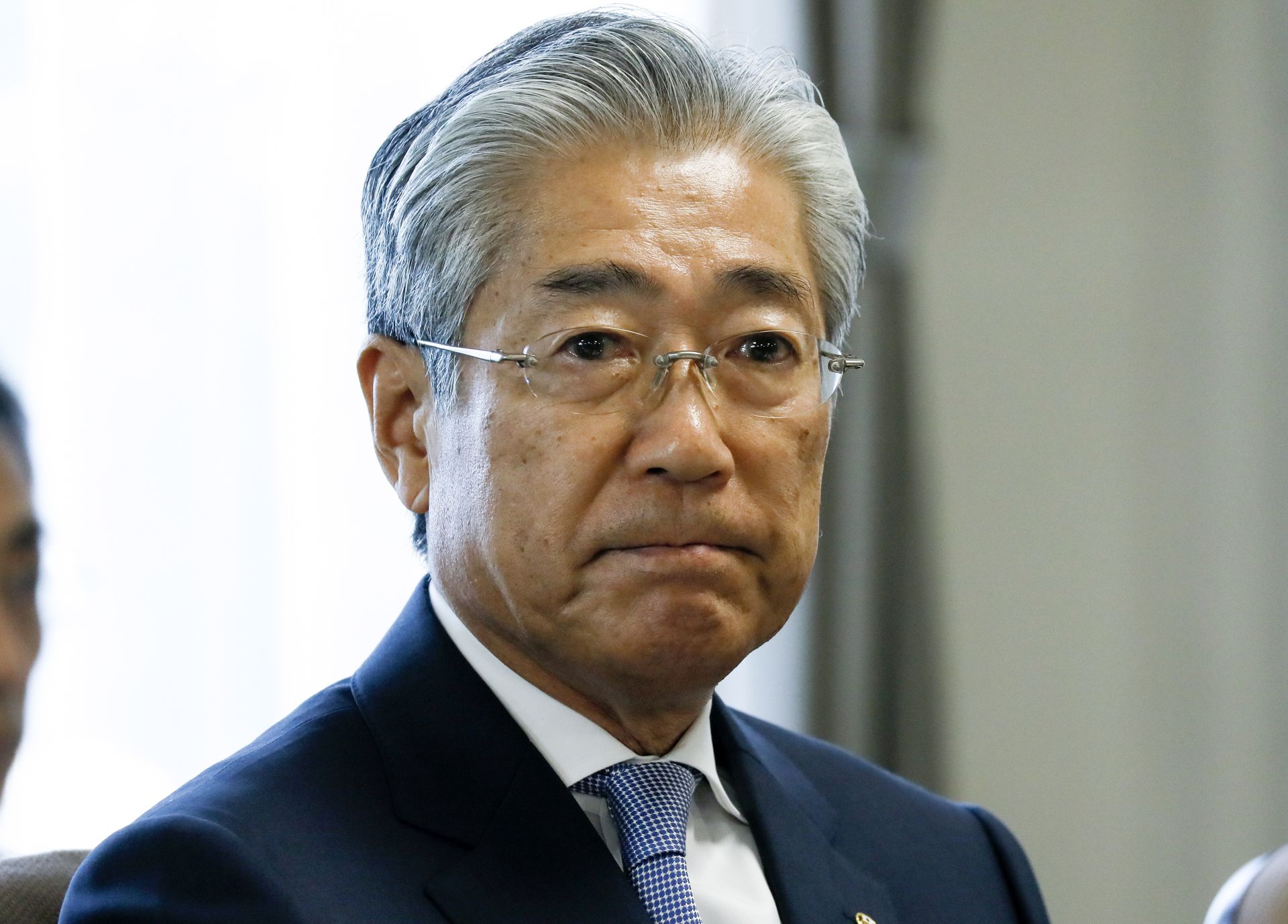 epa07447646 Tsunekazu Takeda (L), President of  Japanese Olympic Committee (JOC), is seen at the start of a JOC board meeting in Tokyo, Japan, 19 March 2019. Takeda is facing an investigation by French authorities' for suspected corruption relating to winning the bid for the 2020 Tokyo Olympics.  EPA/KIMIMASA MAYAMA