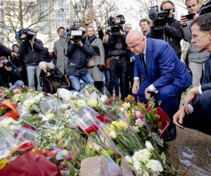epa07448700 Dutch Prime Minister Mark Rutte (R) and Minister of Justice and Security Ferdinand Grapperhaus place floral tributes near the scene of the fatal shooting at 24 Oktoberplein, in Utrecht, The Netherlands, 19 March 2019. Three people were killed and five wounded, in a shooting on a tram in Utrecht, on 18 March 2019 The suspect involved in the attack, Gokmen Tanis, aged 37 born in Turkey, has been arrested by the police.  EPA/ROBIN VAN LONKHUIJSEN