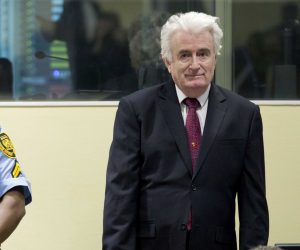 epa07450691 Former Bosnian Serb leader Radovan Karadzic (R) enters the court room of the Former Bosnian Serb leader Radovan Karadzic (R) enters the court room of the International Residual Mechanism for Criminal Tribunals in The Hague, Netherlands, 20 March 2019. Nearly a quarter of a century since Bosnia's devastating war ended, Karadzic is set to hear the final judgment on whether he can be held criminally responsible for unleashing a wave of murder and destruction. United Nations appeals judges will on Wednesday rule whether to uphold or overturn Karadzic's 2016 convictions for genocide, crimes against humanity and war crimes, as well as his 40-year sentence.  EPA/PETER DEJONG / POOL