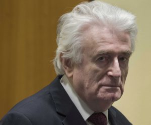 epa07450757 Former Bosnian Serb leader Radovan Karadzic enters the court room of the International Residual Mechanism for Criminal Tribunals in The Hague, Netherlands, 20 March 2019. Nearly a quarter of a century since Bosnia's devastating war ended, Karadzic is set to hear the final judgment on whether he can be held criminally responsible for unleashing a wave of murder and destruction. United Nations appeals judges will on Wednesday rule whether to uphold or overturn Karadzic's 2016 convictions for genocide, crimes against humanity and war crimes, as well as his 40-year sentence.  EPA/PETER DEJONG / POOL