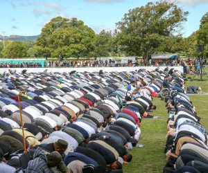 epa07454745 People attend a prayer at Hagley Park, opposite the Al Noor Mosque in Christchurch, New Zealand, 22 March 2019. New Zealand Prime Minister Jacinda Ardern announced on 21 March, that New Zealand will ban all types of military style semi-automatic weapons used in Christchurch attacks after a gunman killed 50 worshippers at the Al Noor Masjid and Linwood Masjid on 15 March.  EPA/MARTIN HUNTER AUSTRALIA AND NEW ZEALAND OUT