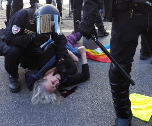 epa07457816 A bleeding woman lies on the floor after being injured during an assault by French Police forces during the 'Act XIX' demonstration (the 19th consecutive national protest on a Saturday) in Nice, France, 23 March 2019. To prevent a repeat of the last week riots on the Champs-Elysees, French authorities have banned demonstrations in large zones of different cities.  EPA/ARNOLD JEROCKI