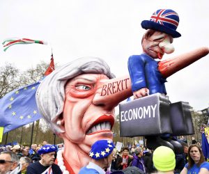 epaselect epa07458307 A float depicting British Prime Minister Theresa May is seen during the 'Put it to the People' march in TLondon, Britain, 23 March 2019. Hundreds of thousands of people take part in the protest calling for a referendum on the final Brexit deal.  EPA/NEIL HALL
