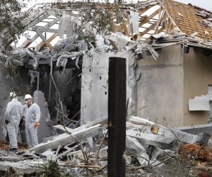 epa07461645 Israeli Police examine a house that suffered a direct hit from a missile reportedly fired by militant groups from the Gaza Strip in Moshav Mishmeret near Netanya, north of Tel Aviv Israel, 25 March 2019. According to media reports, the Israeli Air Force (IAF) attacked military targets in Gaza Strip in retaliation.  EPA/ABIR SULTAN