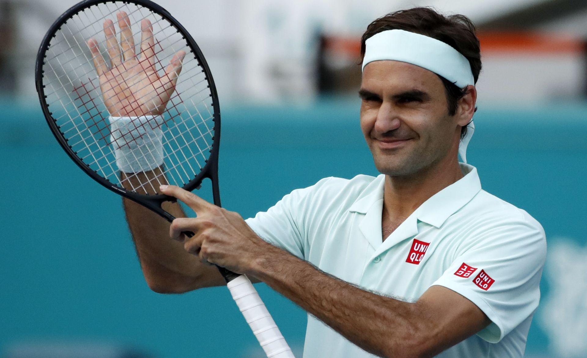epa07467630 Roger Federer of Switzerland reacts after defeating Daniil Medvedev of Russia during their men's singles match at the Miami Open tennis tournament in Miami, Florida, USA, 27 March 2019.  EPA/JASON SZENES