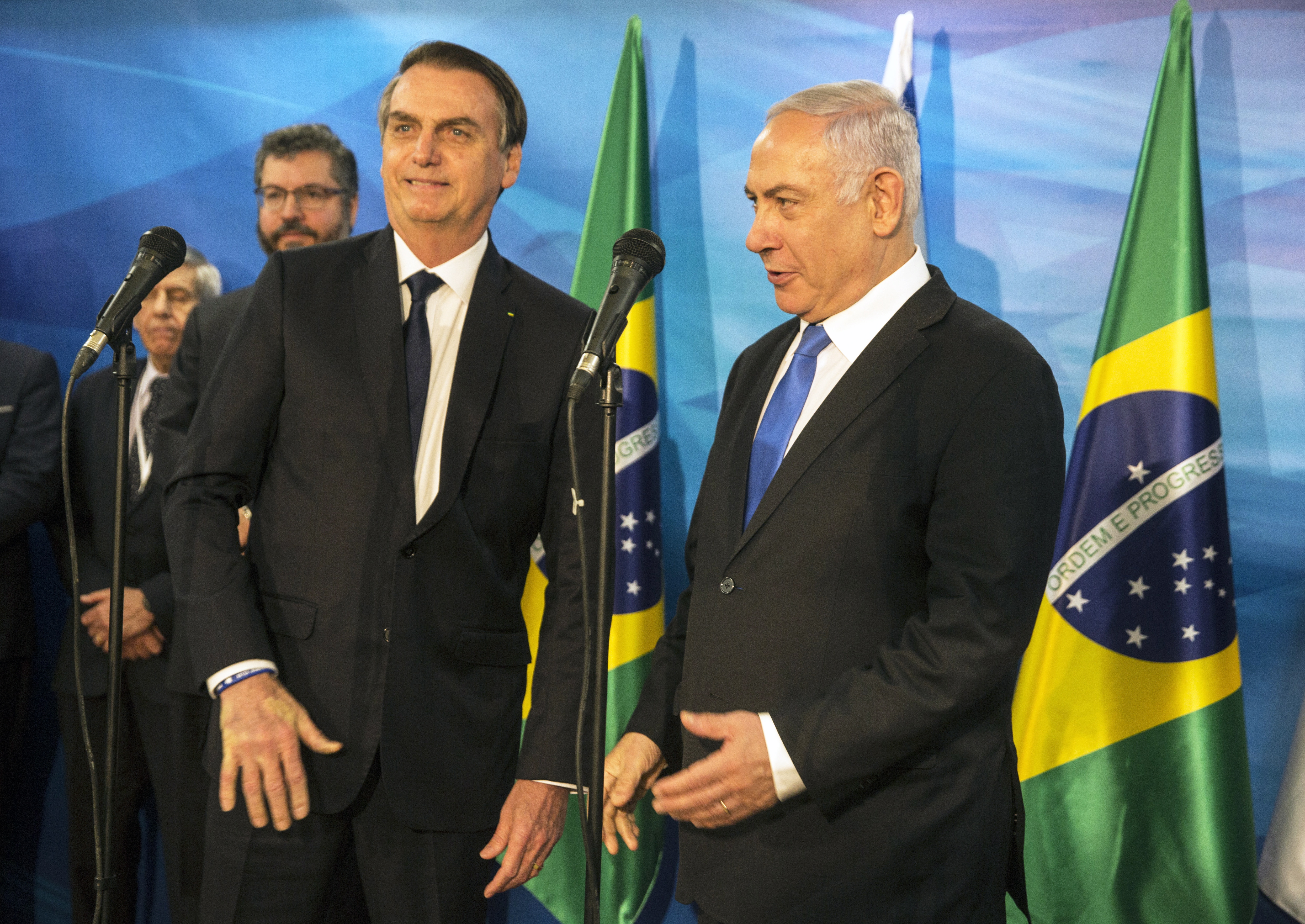 epa07476705 Israeli Prime Minister Benjamin Netanyahu (R) welcomes Brazilian President Jair Bolsonaro (L) at Netanyahu's office in Jerusalem, 31 March 2019. President Bolsonaro arrived for a four-day visit to Israel.  EPA/HEIDI LEVINE / POOL