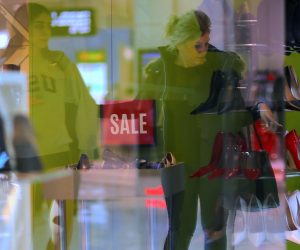 FILE PHOTO - Shoppers can be seen reflected in the window of a retail store selling shoes at a shopping mall in Sydney, Australia FILE PHOTO - Shoppers can be seen reflected in the window of a retail store selling shoes at a shopping mall in Sydney, Australia, July 25, 2017. REUTERS/Steven Saphore/File Photo  GLOBAL BUSINESS WEEK AHEAD Steven Saphore