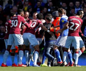 Championship - Birmingham City v Aston Villa Soccer Football - Championship - Birmingham City v Aston Villa - St Andrew's, Birmingham, Britain - March 10, 2019   Aston Villa players react after a fan invades the pitch and attacks Jack Grealish   Action Images via Reuters/Craig Brough    EDITORIAL USE ONLY. No use with unauthorized audio, video, data, fixture lists, club/league logos or "live" services. Online in-match use limited to 75 images, no video emulation. No use in betting, games or single club/league/player publications.  Please contact your account representative for further details. CRAIG BROUGH