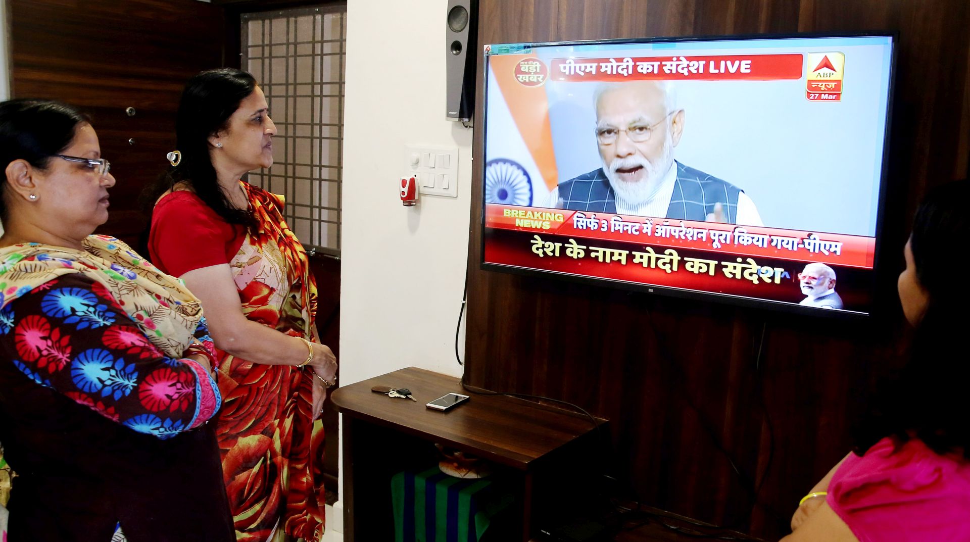 epa07466328 Indian people listen to Indian Prime Minister Narendra Modi's televised address to the nation, in Bhopal, India, 27 March 2019. In a rare address to the nation, Modi announced that Indian scientists conducted Mission Shakti, an anti-satellite missile test that shot down a live satellite at a low-earth orbit. India has entered its name as an elite space power after Indian Space Research Organisation (ISRO) scientists, using an indigenously built anti-satellite missile, successfully shot down a satellite operating in lower orbit.  EPA/SANJEEV GUPTA