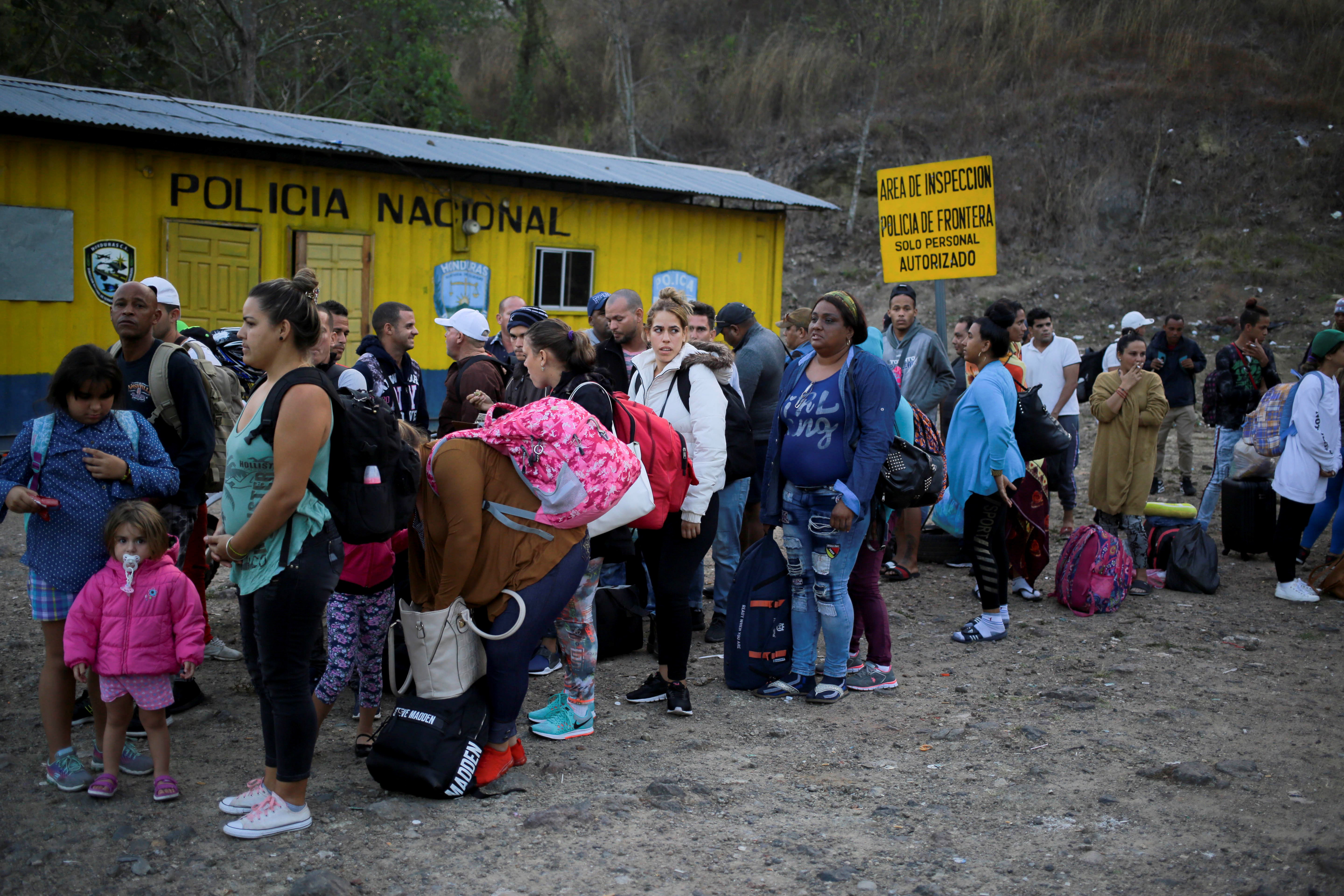epa07501737 Cuban migrants line up for immigration procedures before the Agua Caliente Customs Office at the border cuty of Agua Caliente, Honduras bordering Guatemala, 12 April 2019. At this border point, there is a migrant caravan called for by social networks that left on 09 April from San Pedro Sula, in the north of Honduras.  EPA/GUSTAVO AMADOR