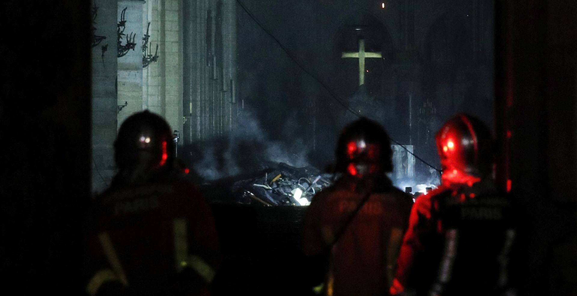 epaselect epa07509110 French firemen enter the Notre-Dame Cathedral as flames are burning the roof cathedral in Paris, France, 15 April 2019. A fire started in the late afternoon in one of the most visited monuments of the French capital.  EPA/YOAN VALAT
