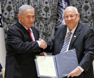 epa07512646 Israeli President Reuven Rivlin (R) hands a letter of appointment for entrusted with forming the next government to Israeli Prime Minister and Chairman of the Likud Party Benjamin Netanyahu (L) at the President's residence in Jerusalem, Israel, 17 April 2019. Benjamin Netanyahu won the 09 April elections and will soon form his government. Netanyahu will enter his fifth term as Prime Minister of Israel.  EPA/ABIR SULTAN