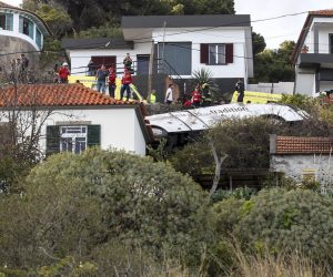 epa07512747 Emergency services inspect the scene of a tourist bus crash in Canico, Santa Cruz, Madeira Island, Portugal, 17 April 2019. According the Civil Protection of Madeira, several people died in the accident.  EPA/HOMEM GOUVEIA