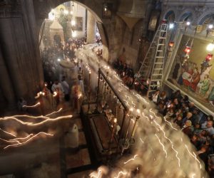 epa07513514 A picture taken with a slow shutter speed effect shows Christian worshippers take part in the procession of the holy Thursday, during the Catholic Washing of the Feet ceremony on Easter Holy Week, at the Church of the Holy Sepulcher in Jerusalem's old city, 18 April 2019.  EPA/ATEF SAFADI