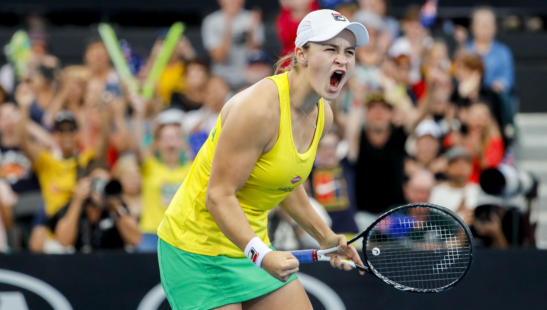 epa07518676 Ashleigh Barty of Australia celebrates her win against Aryna Sabalenka of Belarus during the Fed Cup tennis tournament World Group semifinal between Australia and Belarus at Pat Rafter Arena in Brisbane, Australia, 21 April 2019.  EPA/GLENN HUNT  AUSTRALIA AND NEW ZEALAND OUT