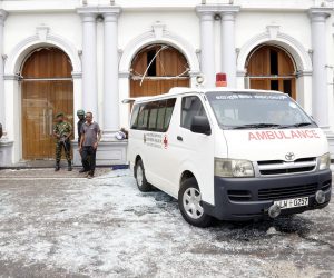 epa07518790 Police officers inspect the scene after a explosion hit at St Anthony's Church in Kochchikade in Colombo, Sri Lanka, 21 April 2019. According to the news reports at least 25 people killed and over 200 injured in a series of blasts during the Easter Sunday service at St Anthony's Church in Kochchikade and explosions also reported at the Shangri-La Hotel and Kingsbury Hotel.  EPA/M.A. PUSHPA KUMARA