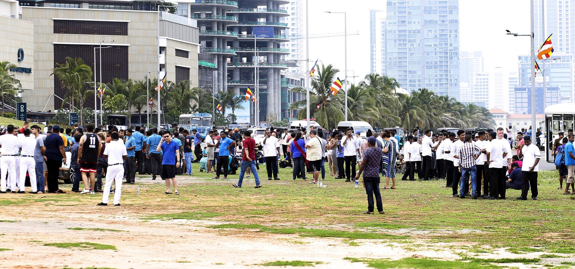 epa07519449 Hotel staffs and guests gather in the open after an explosion hit Shangri-La Hotel  in Colombo, Sri Lanka, 21 April 2019.  According to news reports at least 138 people killed and over 400 injured in a series of blasts during the Easter Sunday service at St Anthony's Church in Kochchikade, Shangri-La Hotel and Kingsbury Hotel with many more places.  EPA/M.A. PUSHPA KUMARA