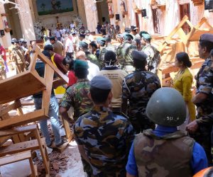 epa07519704 Police and locals inpect the damage and fataliaties in Katuwapitiya St. Sebastian church in Negombo near Colombo, Sri Lanka, 21 April 2019. According to police at least 207 people were more than 400 injured in a coordinated series of blasts during the Easter Sunday service at churches and hotels.  EPA/STR