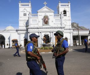 epa07520915 Sri Lankan security personal stand guard outside St. Anthony's Church in Kochchikade, Colombo, Sri Lanka, 22 April 2019. According to news reports, at least 290 people have been killed and over 500 injured in a series of blasts during Easter Sunday service at churches and hotels across Colombo on 21 April.   EPA/M.A. PUSHPA KUMARA
