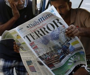 epa07520824 People read a newspaper the day after multiple blasts killed hundreds in Colombo, Sri Lanka, 22 April 2019. According to news reports, at least 290 people have been killed and over 500 were injured on 21 April 2019 in a series of blasts during Easter Sunday service at churches and hotels across Colombo.  EPA/M.A. PUSHPA KUMARA