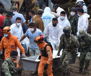epa07521949 Volunteers, members of Civil Defense and soldiers move two bodies recovered after a landslide, in the village Portachuelo, in the municipality of Rosas, Cauca, Colombia, 22 April 2019. Colombian authorities resumed search and rescue operations on Monday of more than a dozen people missing due to the landslide caused by heavy rains in Rosas, a municipality in the department of Cauca (southwest), which left at least 17 people dead and 5 injured on Sunday.  EPA/Ernesto Guzman Jr