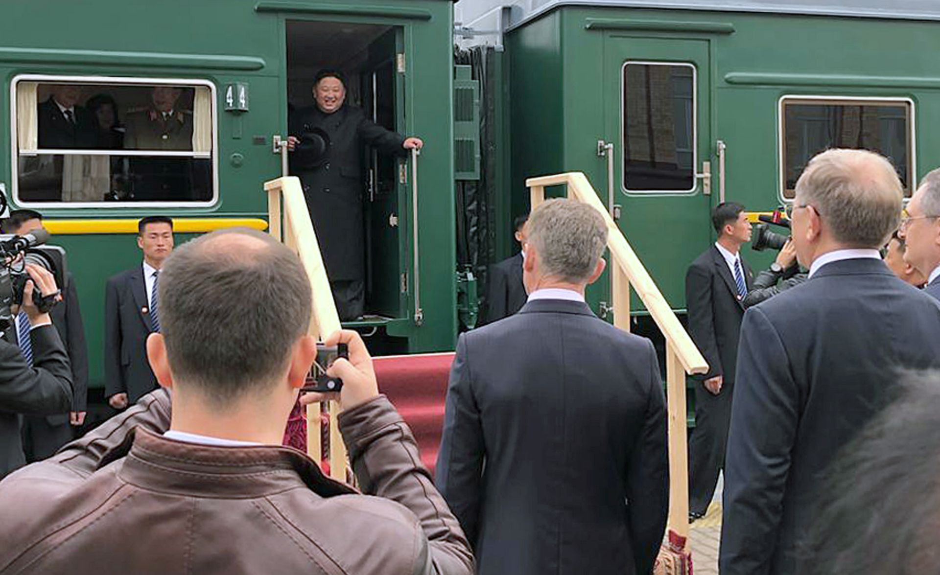 epa07524342 North Korean leader Kim Jong-un (top) is welcomed as he arrives in the Russian border city of Khasan, Russia, 24 April 2019. A summit between North Korean leader Kim Jong-un and Russian President Vladimir Putin is to take place on 25 April 2019 in Vladivostok.  EPA/YONHAP SOUTH KOREA OUT