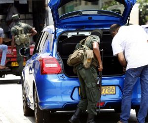 epa07526912 Sri Lankan security personnel check vehicles in Colombo, Sri Lanka, 25 April 2019. According to the news reports, most public places have no people around as security agencies continue to find suspected bomb detonators after at least 320 people were killed in a coordinated series of blasts during the Easter Sunday service at churches and hotels in Sri Lanka on 21 April 2019.  EPA/M.A. PUSHPA KUMARA