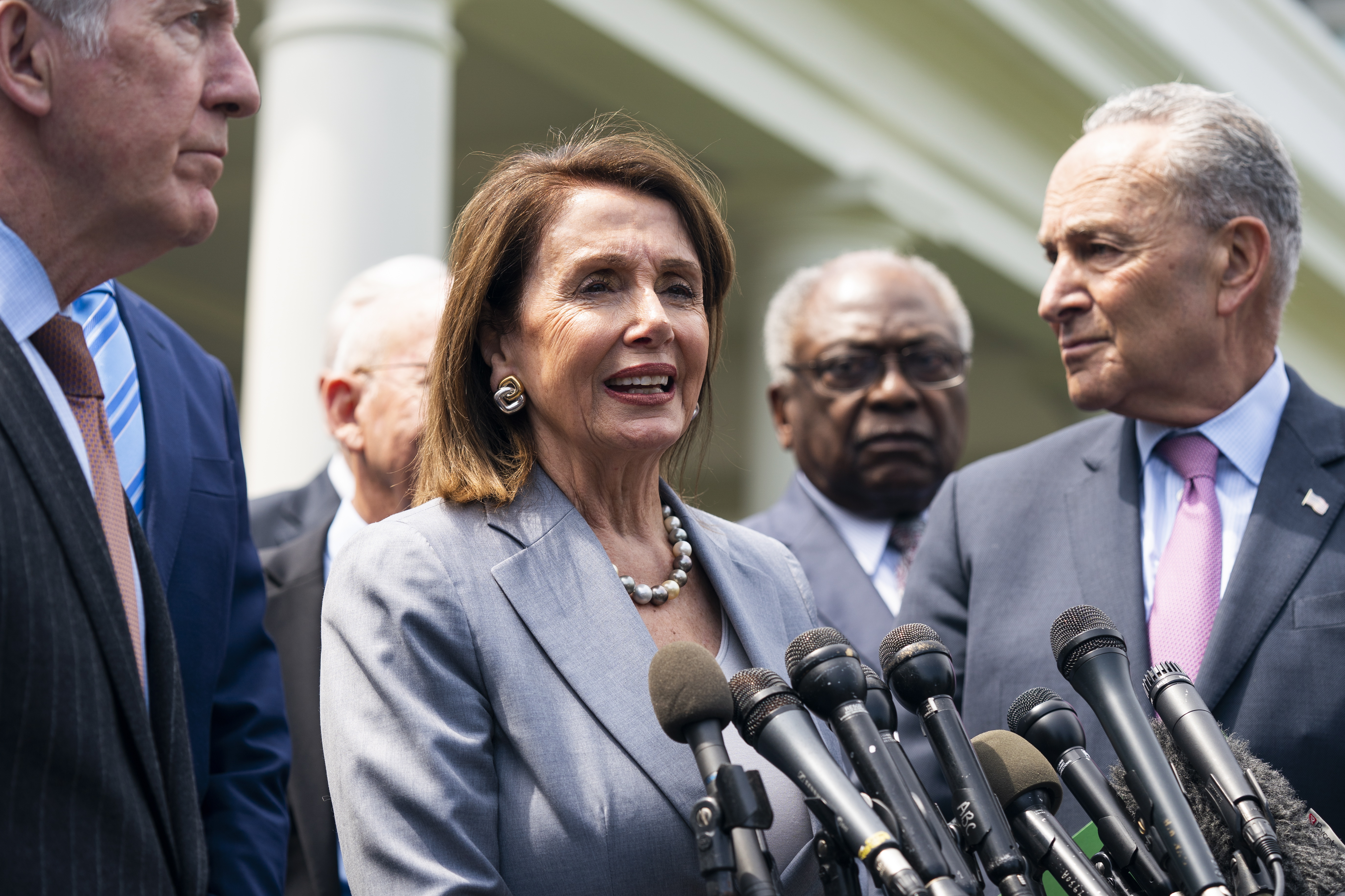 epa07538409 Democratic Speaker of the House from California Nancy Pelosi (C) and Senate Minority Leader from New York Chuck Schumer (R), along with other Democratic lawmakers, prepare to speak to the media outside the West Wing after meeting with President Trump about infrastructure funding at the White House in Washington, DC, USA, 30 April 2019.  EPA/JIM LO SCALZO