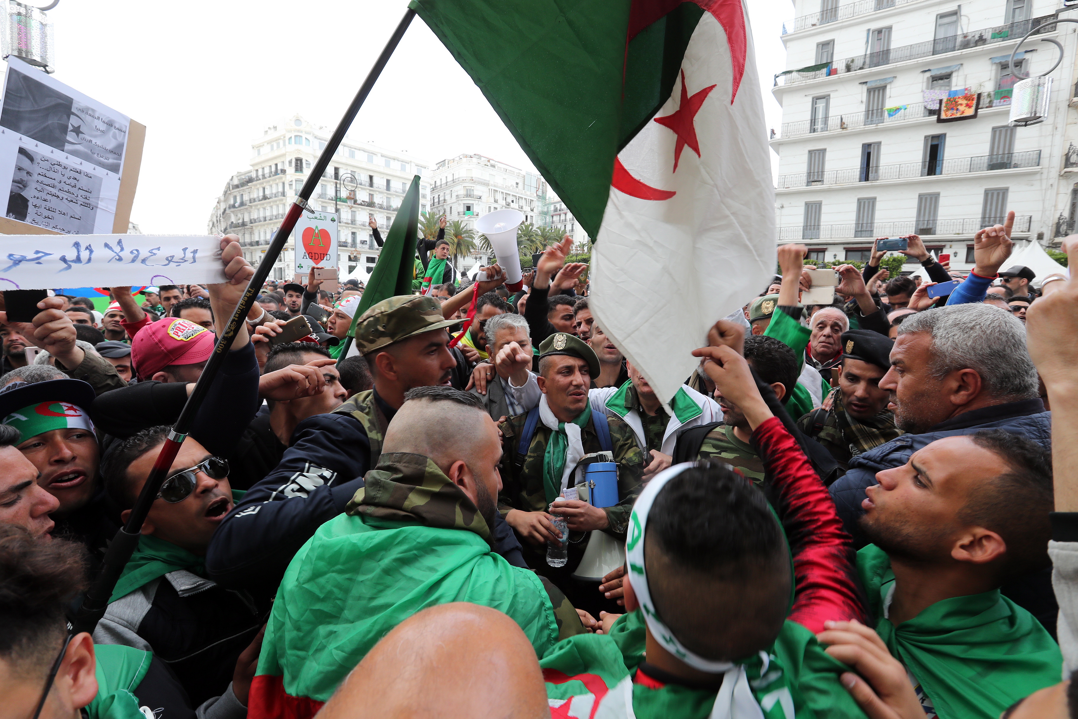 epa07515388 Algerian protesters shout slogans during a demonstration demanding for the departure of the entire Algerian regime, in Algiers, Algeria, 19 April 2019. The Algerians protests that began in early February 2019, after former president Abdelaziz Bouteflika announced his candidacy for a fifth presidential term, continue to call for radical change of the system.  EPA/MOHAMED MESSARA