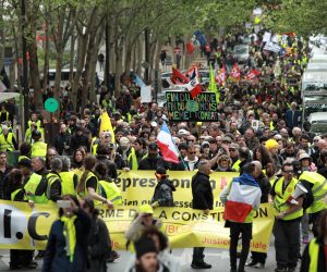 epa07531909 Protesters from the 'Gilets Jaunes' (Yellow Vests) movement march through Paris' streets during the 'Act XXIV' demonstration (the 24th consecutive national protest on a Saturday) in Paris, France, 27 April 2019. Yellow Vest protests are expected in several cities across France.  EPA/CHRISTOPHE PETIT TESSON