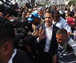 epa07538290 President of the Venezuelan Parliament Juan Guaido (c) participate in a demonstration in Caracas, Venezuela, 30 April 2019. Reports state that at least one person was injured during the clashes at La Carlota after Guaido called for mass anti-government protests backed by the military. Venezuelan interim President Juan Guaido has asked supporters to take to the streets in order to end the regime of President Nicolas Maduro. Meanwhile, Venezuelan opposition leader Leopoldo Lopez was freed from his house arrest, appearing alongside Guaido and military forces in Caracas.  EPA/Miguel Gutierrez