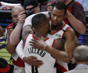 epa07546077 Portland Trail Blazers guard Damian Lillard (L) congratulates teammate Portland Trail Blazers guard Rodney Hood (R) after a four overtime Western Conference second round playoff game three between the Denver Nuggets and the Portland Trail Blazers at the Moda center in Portland, Oregon, USA, 03 May 2019.  EPA/STEVE DIPAOLA  SHUTTERSTOCK OUT