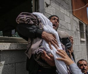 epa07548332 A Palestinian relative of fourteen-month baby girl Seba Abu-Arrar carries her body during her funeral with her relative woman in Al-Zaitun neighborhood in the east of Gaza City on, 05 May 2019. According to media reports, Hamas announced a total of four Palestinians have been killed in Gaza, include a woman and her 14-month-old daughter.The Israeli army announces it killed two Palestinian fighters in sites belonging to the militant groups Hamas. and the mother and baby may have been killed by a Palestinian rocket that fell short of its target.  EPA/HAITHAM IMAD